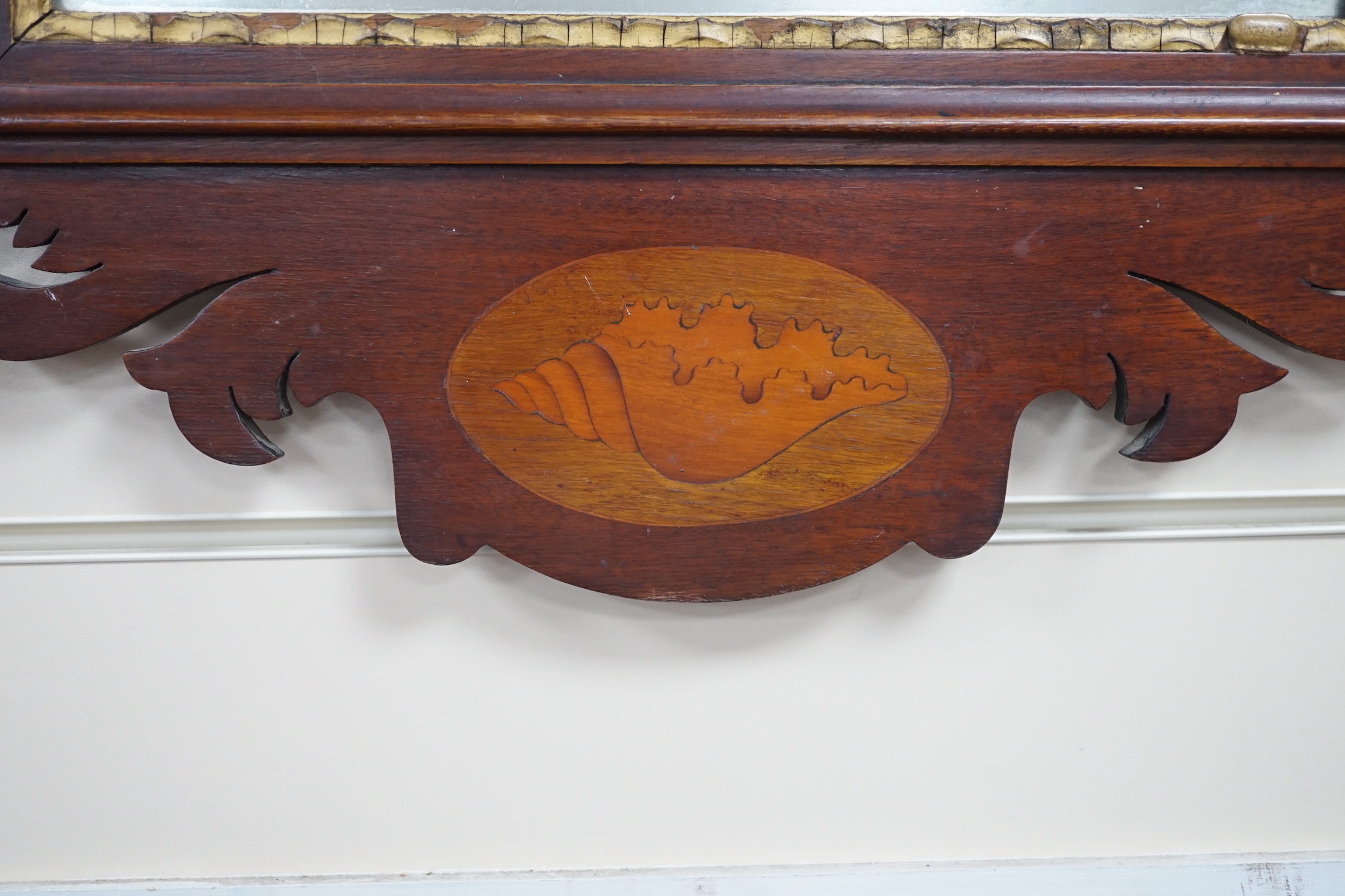 Two George III style inlaid mahogany fret cut wall mirrors, larger width 52cm, height 90cm